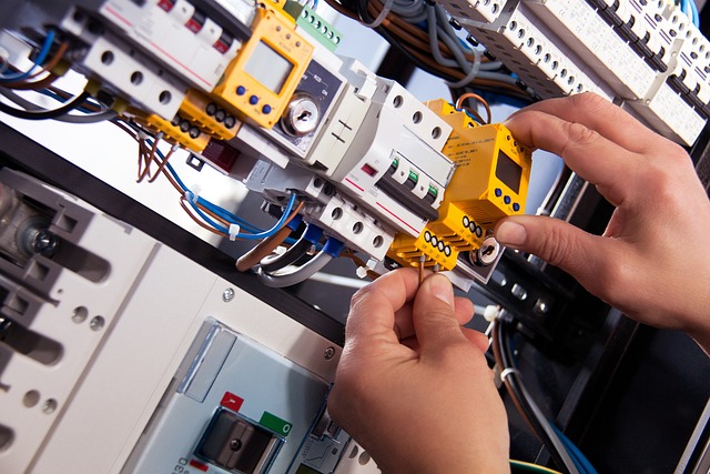 A trainee works at a commercial training centre to get their qualifications to become an electrician
